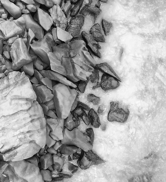 Overhead aerial view of Seychelles Beach with rocks, ocean landscape.