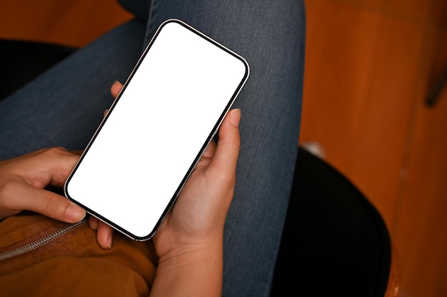 Overhead Female using smartphone to chat with someone Phone white screen mockup