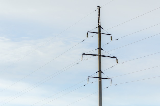 Overhead high-voltage power line tower.