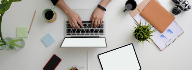 Overhead shot of businesswoman working in minimal workspace