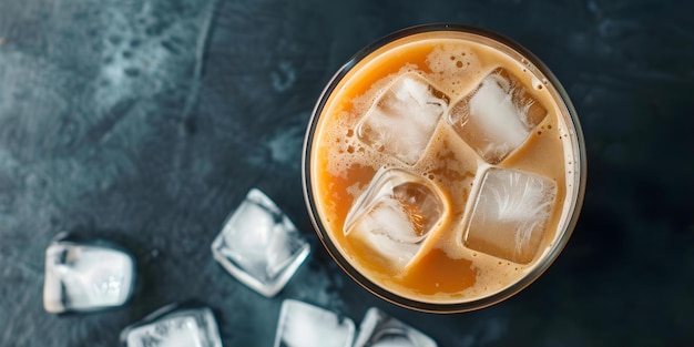 Overhead shot of iced latte in glass with ice cubes Concept Food Photography Iced Coffee Refreshing Beverages Summer Drinks Creative Composition