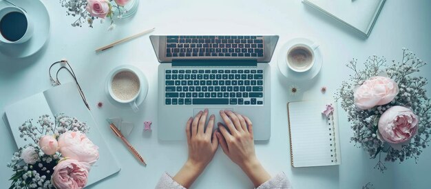 Photo overhead shot of womans hands working on laptop on white table with accessories office desktop flat lay ai generated