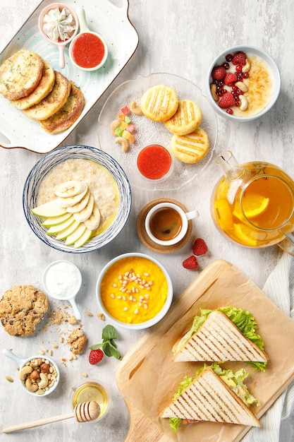 Overhead view of breakfast on light grey background