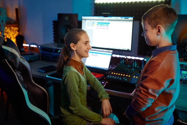 Overhead view on children musician mixing soundtrack