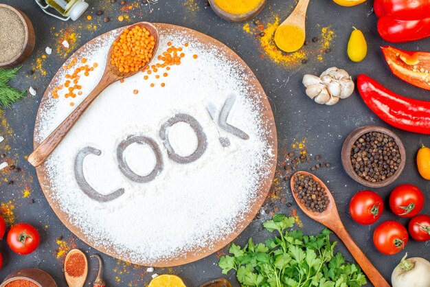 Photo overhead view of cook writing with flour