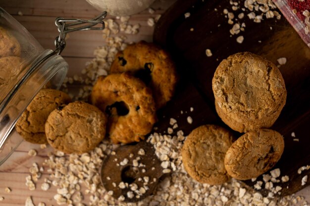 Overhead view of a Fallen Oatmeal Raisin Cookie Jar and a cookie tower alongside. heatly food.