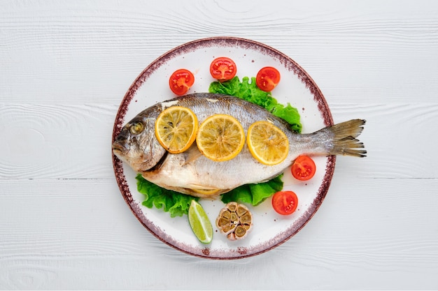 Overhead view of gilt head bream baked in oven