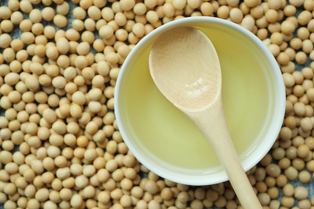 Overhead view of Soy beans and oil on table