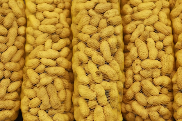 Overhead view of stack of many peanuts in a packet