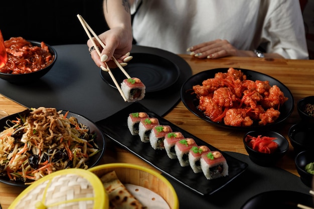 Overhead view of table with Chinese food Dark moody stock image