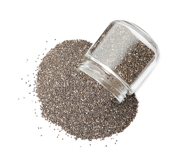 Overturned jar with chia seeds on white background top view