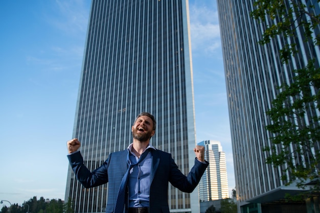 Overworked excited business man hard business work