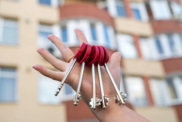 Owner holds the key to the new house from the realtor