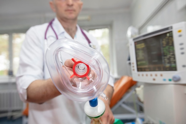 Oxygen mask as part of a ventilator in the operating room closeup