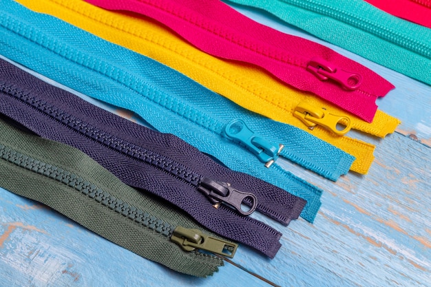 Pack lot of colorful plastic and metal zippers stripes patter