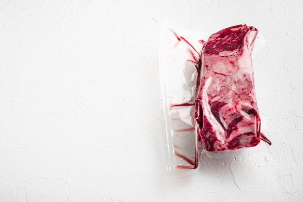 pack with fresh beef steak cut for sous vide in vacuum plastic market bag set