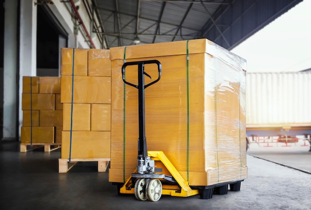 Packaging Boxes Wrapped Plastic on Pallets with Hand Pallet Truck Shipping Warehouse Cargo Shipment