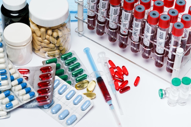 Packings of pills and capsules of medicines and blood test tubes