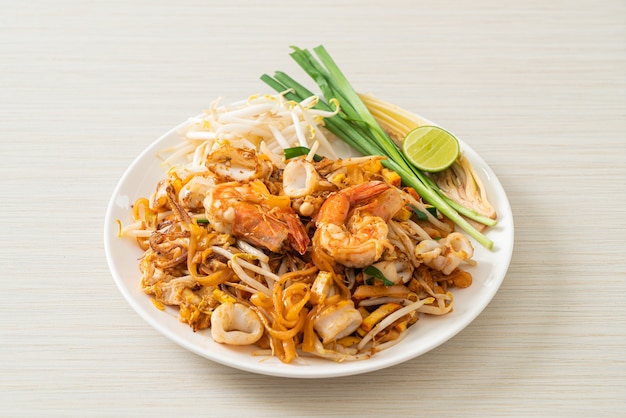 Pad Thai Seafood - Stir fried noodles with shrimps, squid or octopus and tofu in Thai style