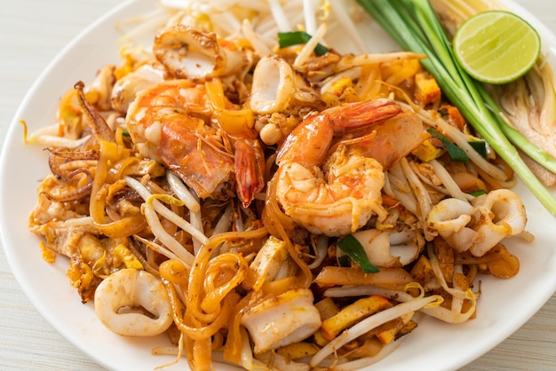 Pad Thai Seafood - Stir fried noodles with shrimps, squid or octopus and tofu in Thai style