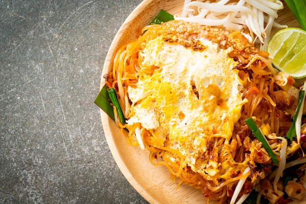 Pad Thai - stir fried noodles in Thai style with egg - Asian food style