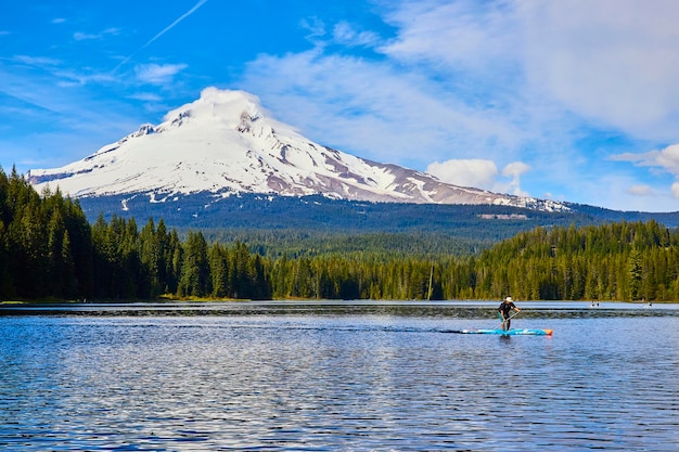 Paddleboarder on Serene Lake with Mount Hood in Background