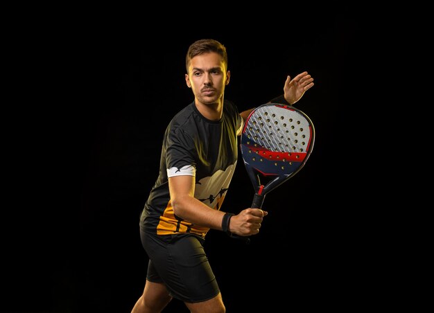 Photo padel tennis player banner on the black background paddle tenis template for ads with copy space