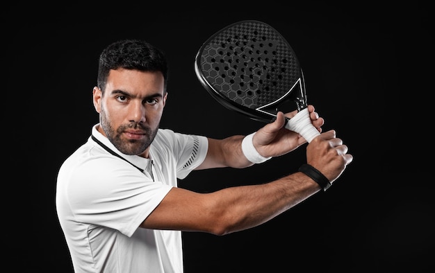 Photo padel tennis player man athlete with paddle tenis racket on black background sport concept download