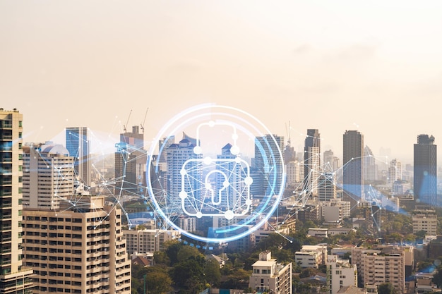 Padlock icon hologram over panorama city view of Bangkok to protect business in Southeast Asia The concept of information security shields Double exposure