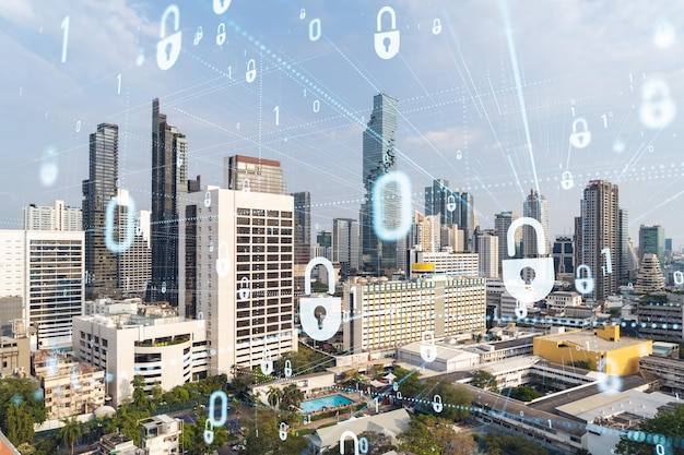 Padlock icon hologram over panorama city view of Bangkok to protect business in Southeast Asia The concept of information security shields Double exposure