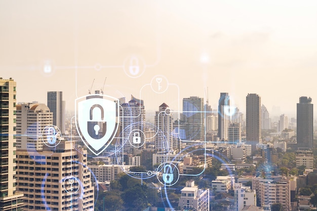 Padlock icon hologram over panorama city view of Bangkok to protect business in Southeast Asia The concept of information security shields Double exposure