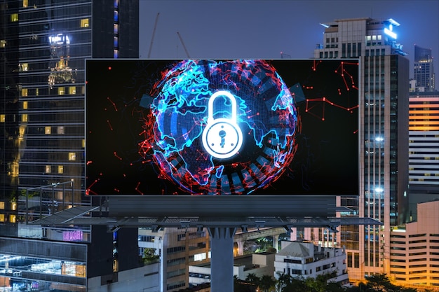 Padlock icon hologram on road billboard over panorama city view of Bangkok at night to protect business Southeast Asia The concept of information security shields