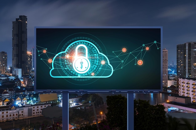 Padlock icon hologram on road billboard over panorama city view of Bangkok at night to protect business Southeast Asia The concept of information security shields