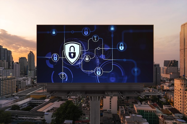 Padlock icon hologram on road billboard over panorama city view of Bangkok at sunset to protect business Southeast Asia The concept of information security shields