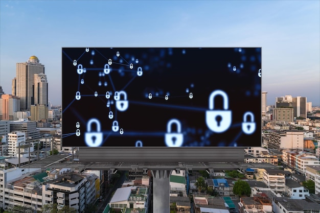 Padlock icon hologram on road billboard over panorama city view of Bangkok at sunset to protect business Southeast Asia The concept of information security shields