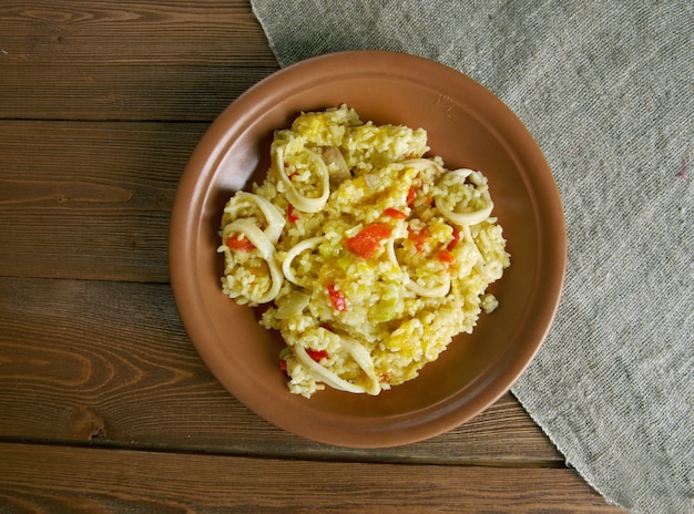 Paella with squid, pumpkin and sweet peppers