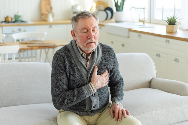 Pain on heart heart attack unhappy middle aged senior man suffering from chest pain heart attack pro