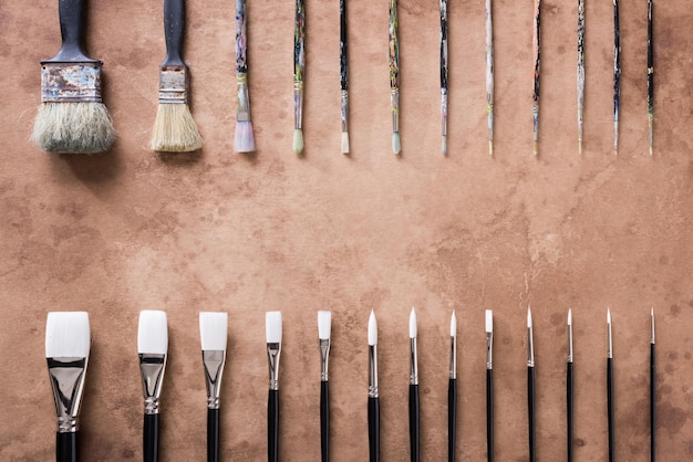 Paint brush on old parchment paper vintage aged or texture background