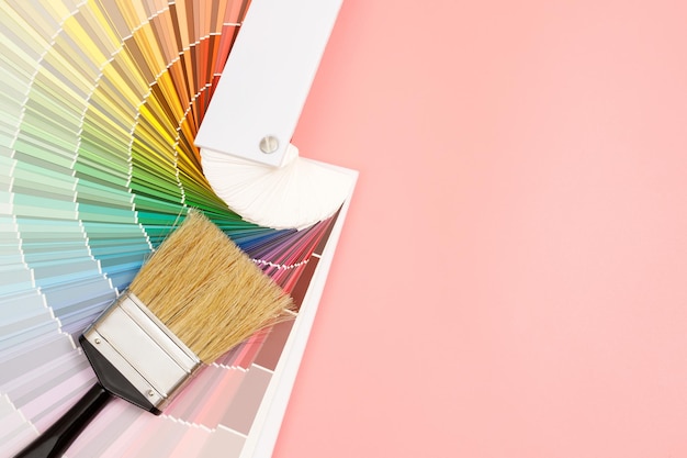 Paint brush on pink background how to choose the perfect home paint color and good for health