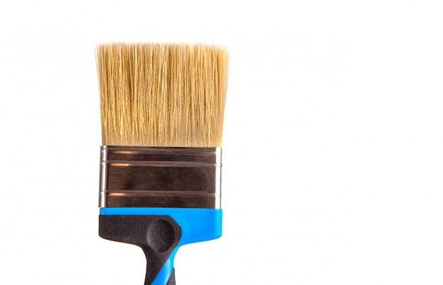 Paint brush with natural bristles on a white isolated background.