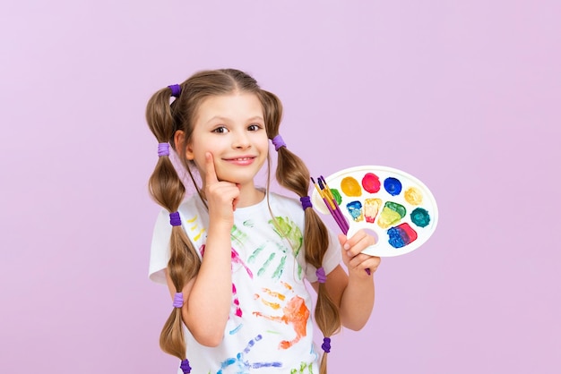 Paint painting school A beautiful girl with paints and brushes on an isolated background Development of children's creativity