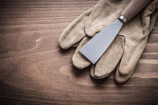 Paint scraper on working glove