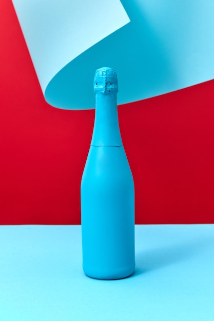 Painted blue mockup bottle of wine on a duotone curly background