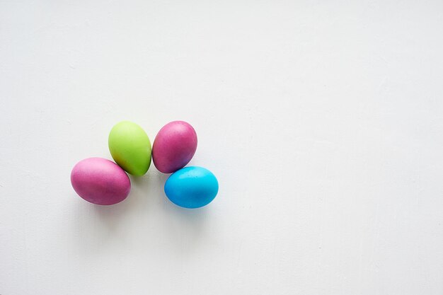 Painted multicolored eggs against a light background Diet protein proteinPreparing for Easter