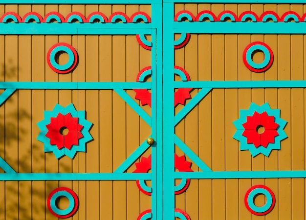 Painted wooden gates with patterns.