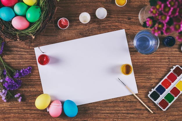 Painting eggs for easter holiday celebration toned picture top view selective focus copyspace