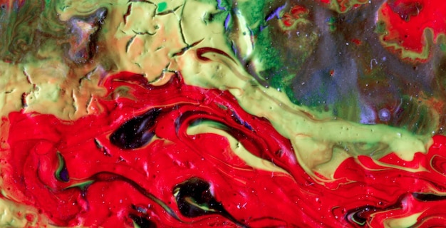 A painting of a red and green swirl.