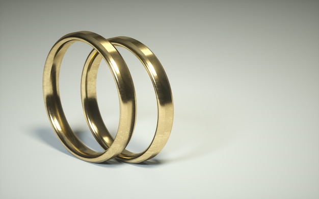 Photo pair of a 3d golden wedding ring. alliances. relationship rings on a white background