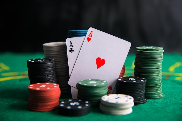 Pair of aces with poker chips