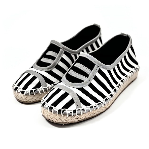 A pair of black and white striped sandals on a white background